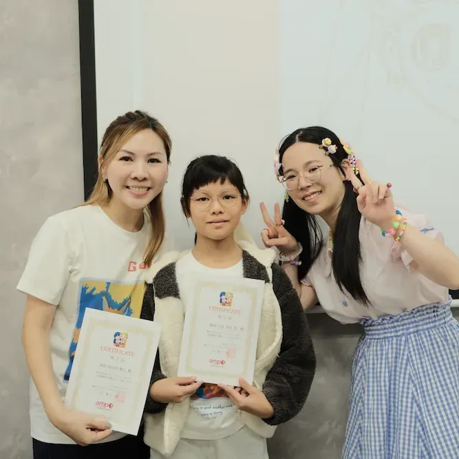 A parent, a student and an instructor holding amps certificates together
