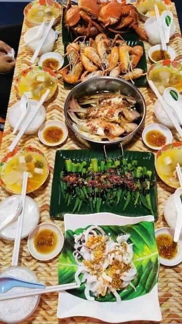 Seafood spread of crab, prawns, steamed fish, grilled skewers and squid with dipping sauces.