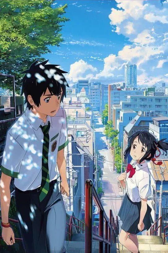 Still from the film Your Name: two students on shrine steps above a Tokyo street